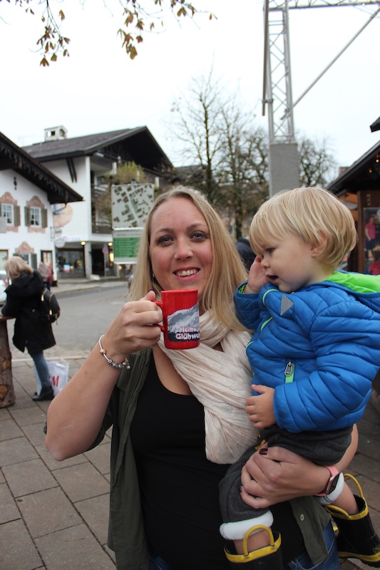 Stephanie holding her child during a family outing